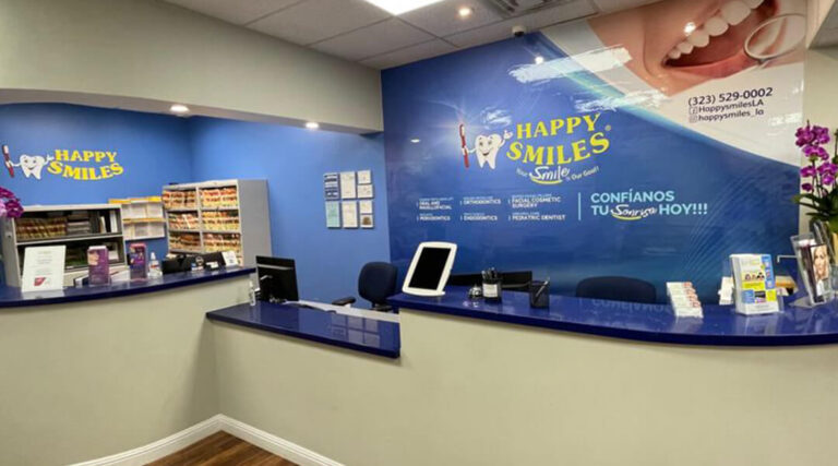 Happy Smiles Dental Clinic reception area with friendly staff ready to assist patients.